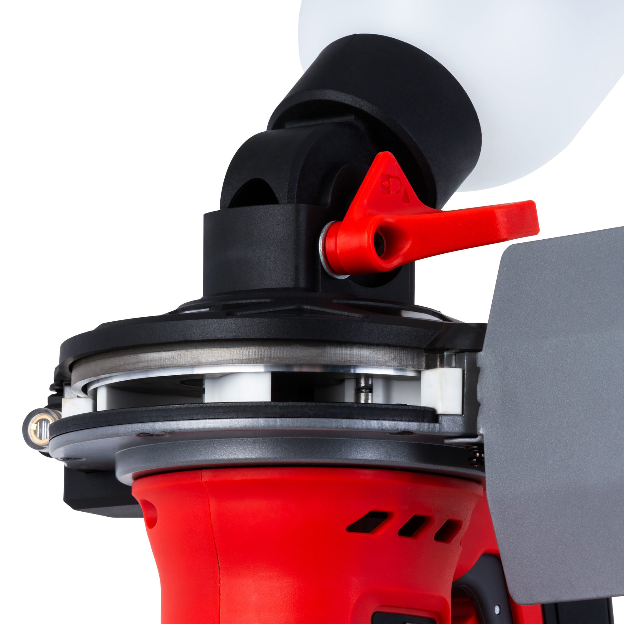 Close-up of the BLSTR sander's swivel joint and red locking lever with the grit bottle fitted
